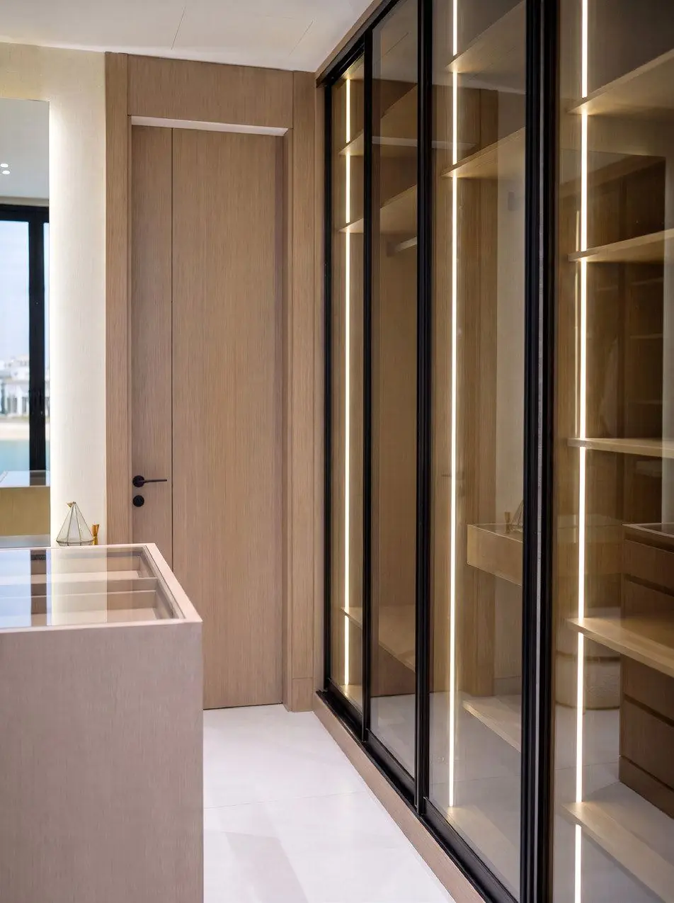 Glass-fronted wardrobe with veneer interiors